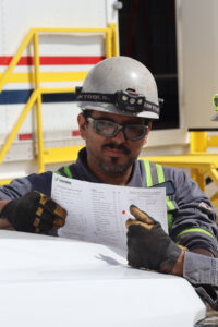 Worker reviewing procedures